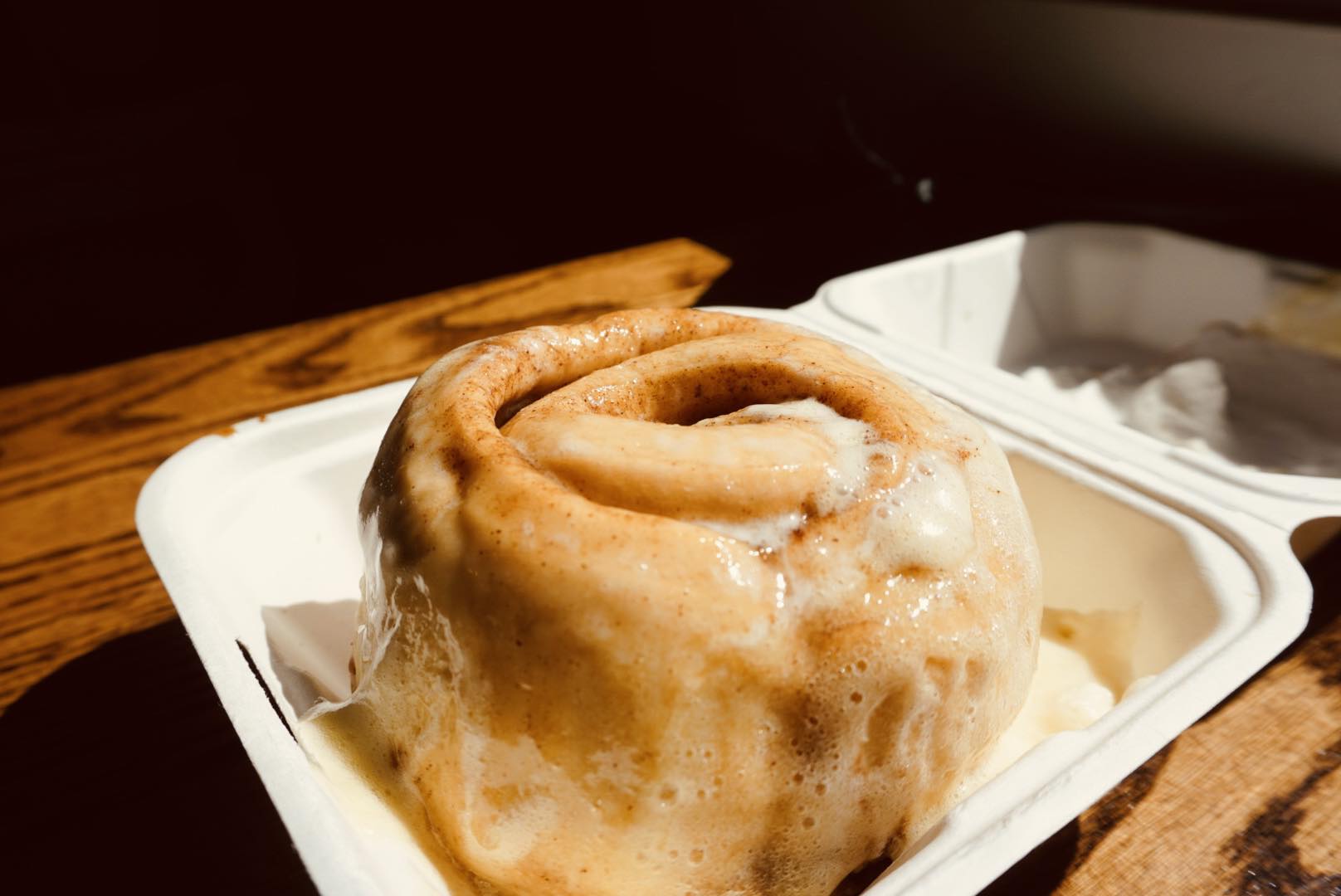 A picture of a cinnamon roll ay Happy Endings Caboose Cafe